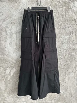 мужские черные брюки-клеш с большим карманом во всю длину и широкими штанинами